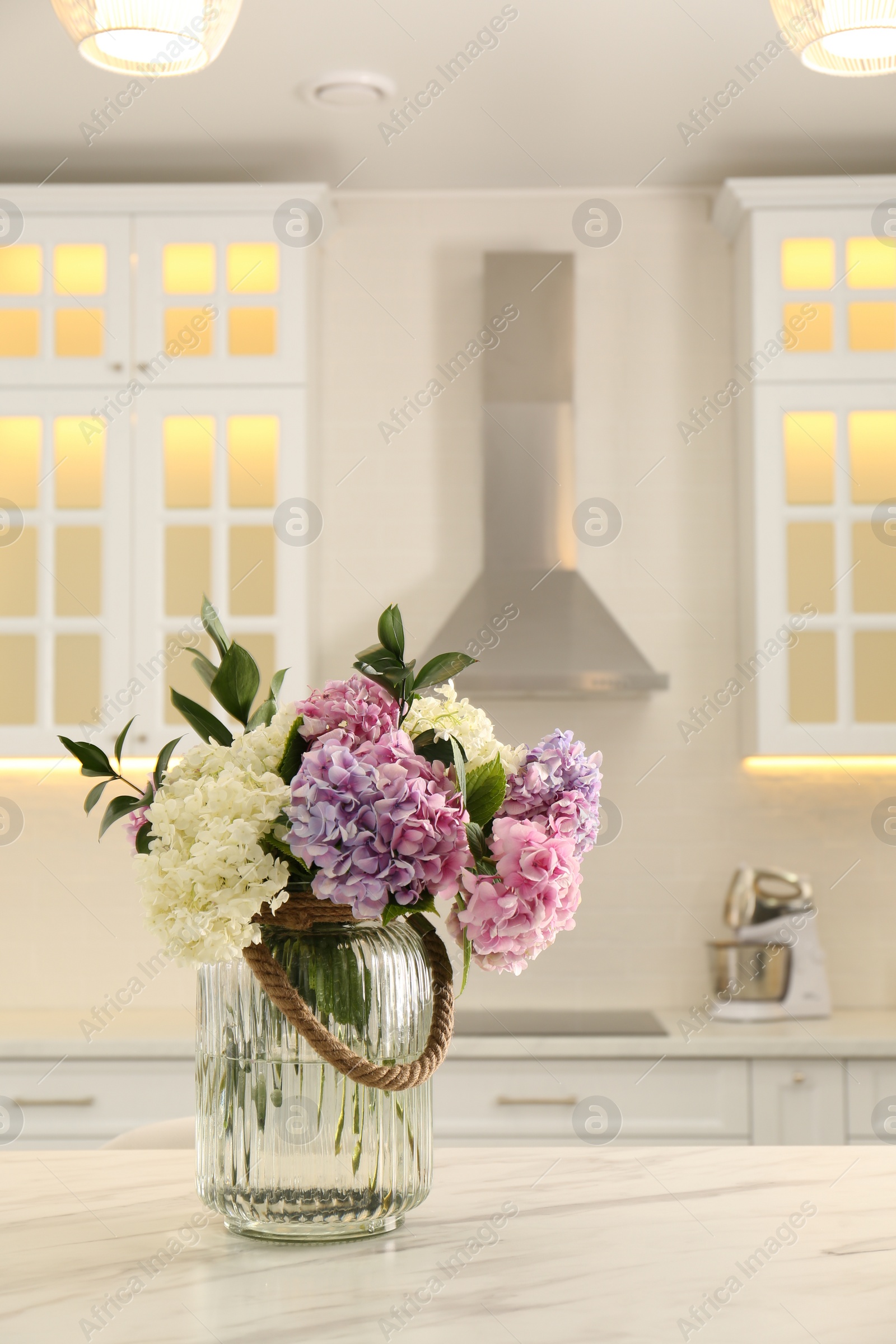 Photo of Bouquet with beautiful hydrangea flowers on white marble table