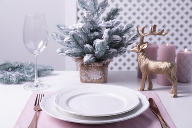 Stylish table setting and festive decor on white background