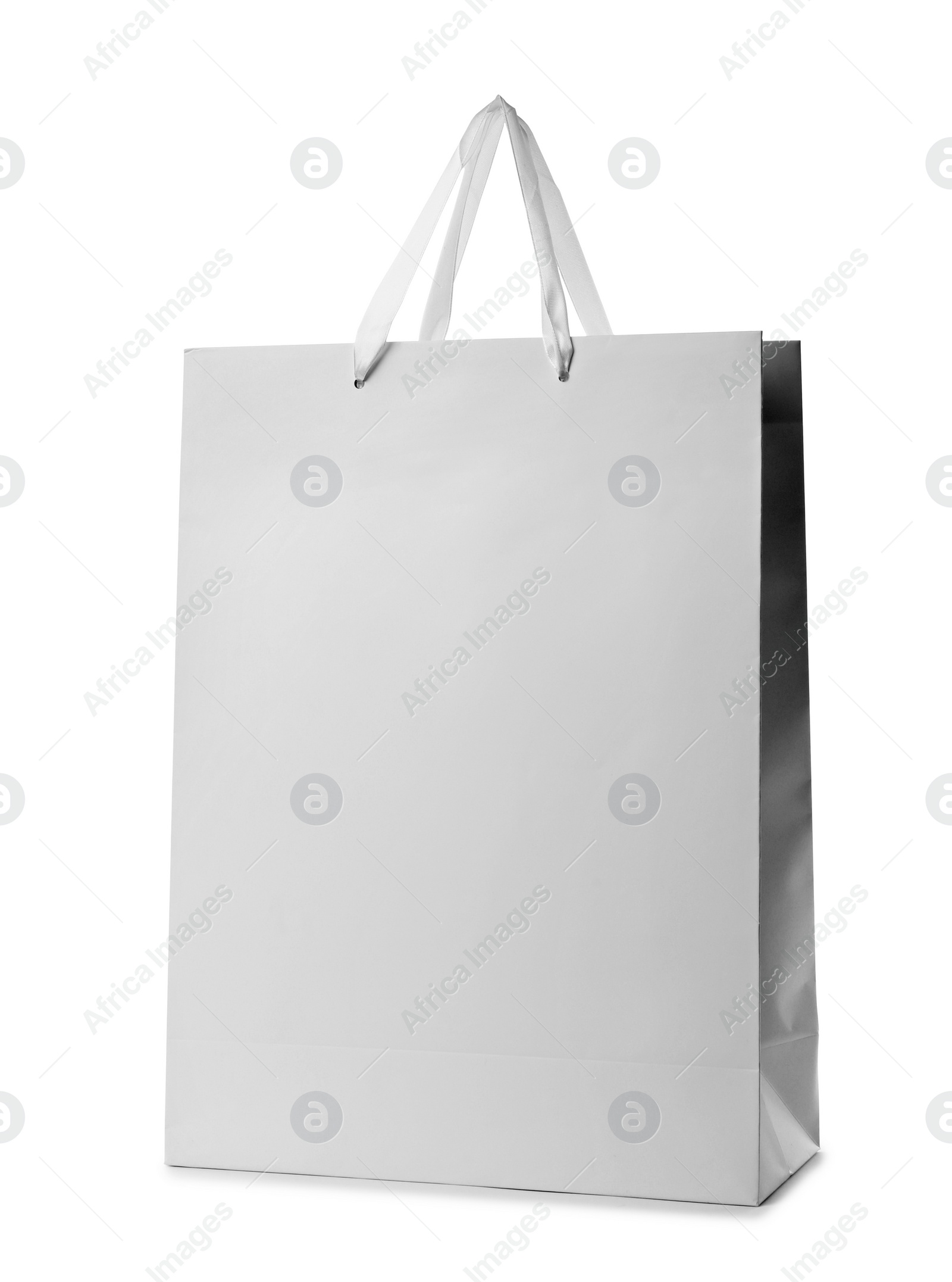 Photo of Paper shopping bag with handles on white background. Mockup for design