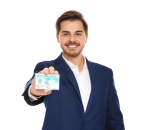 Photo of Happy young businessman with driving license on white background