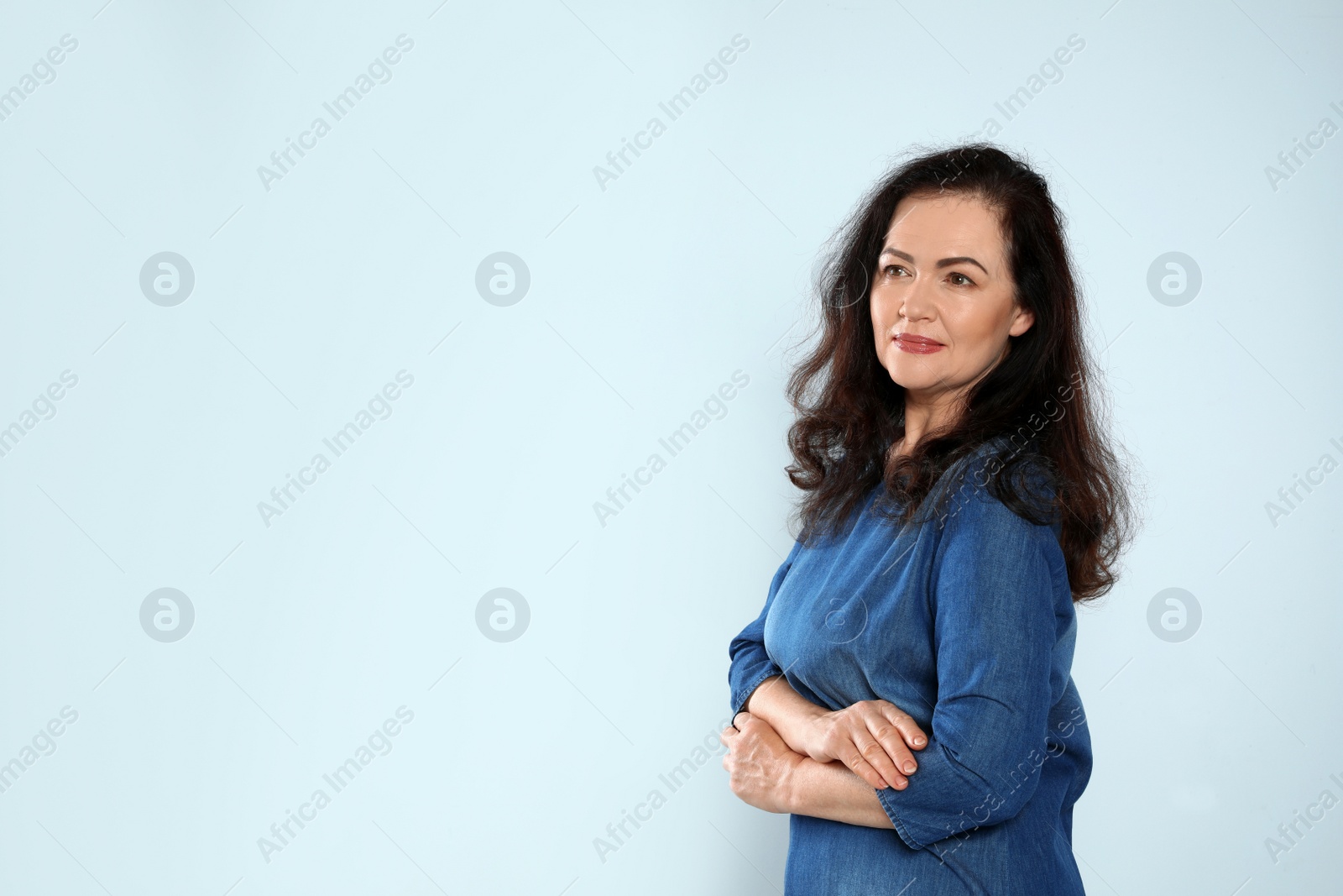 Photo of Portrait of mature woman with beautiful face on grey background. Space for text