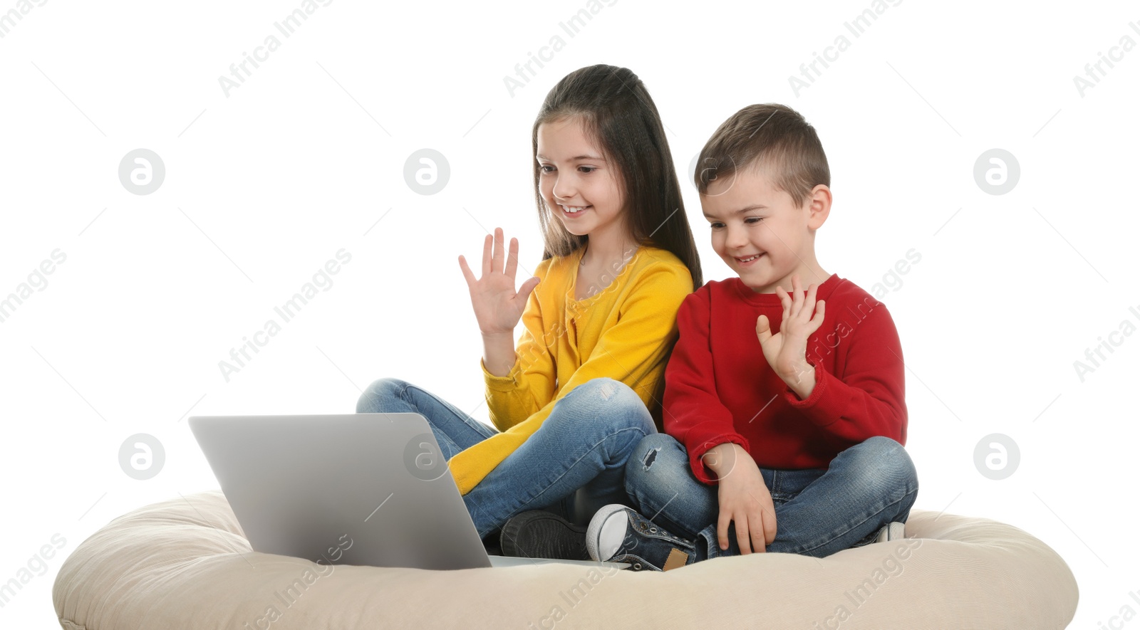 Photo of Little children using video chat on laptop against white background