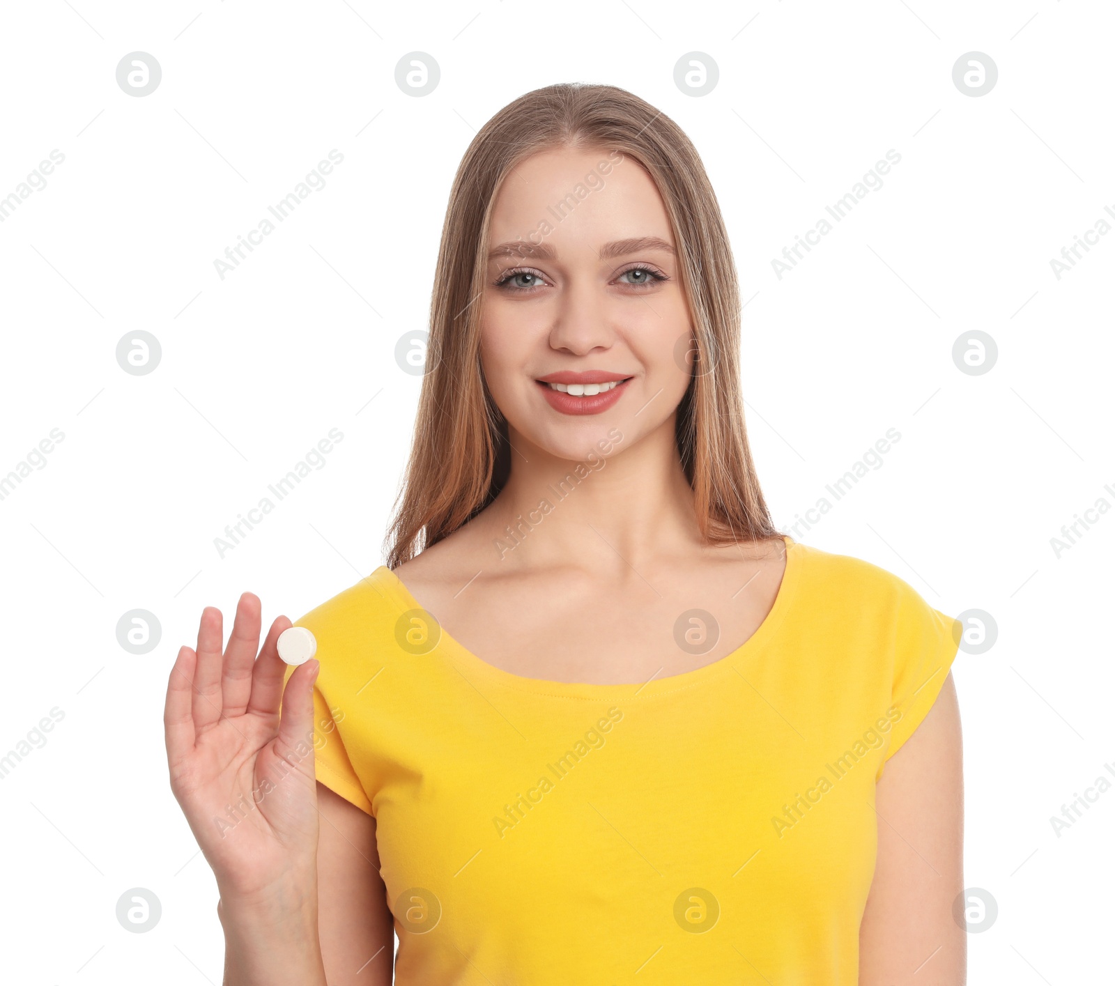 Photo of Young woman with vitamin pill on white background