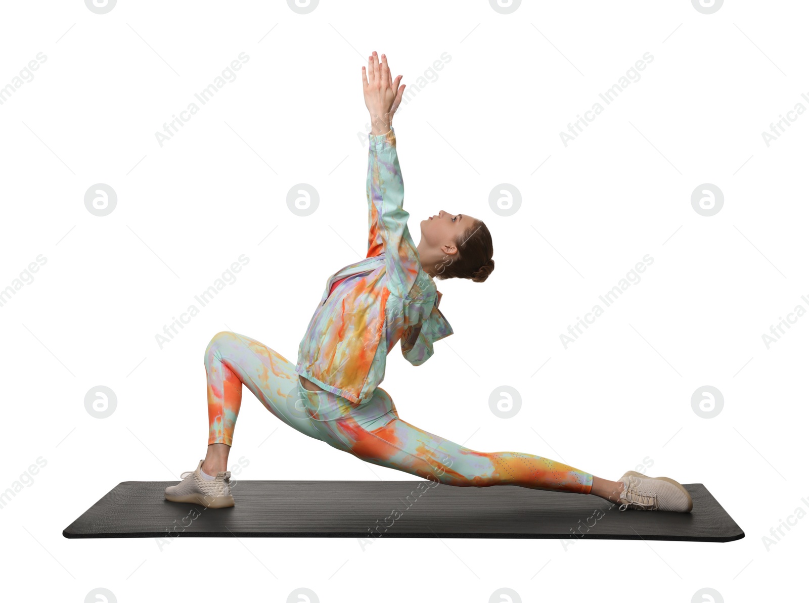 Photo of Yoga workout. Young woman stretching on white background