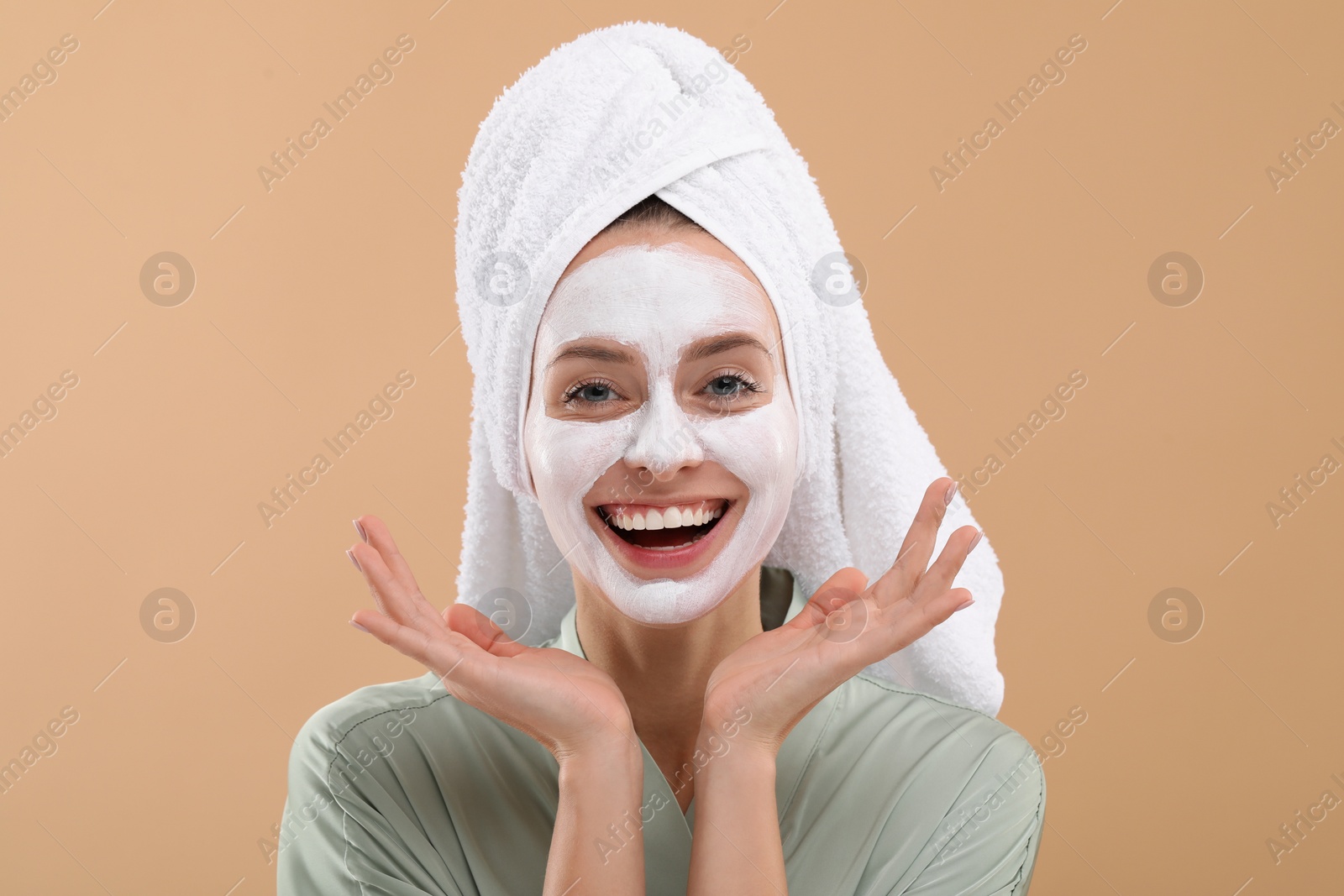 Photo of Woman with face mask on beige background. Spa treatments