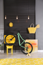 Photo of Modern bicycle in stylish living room interior