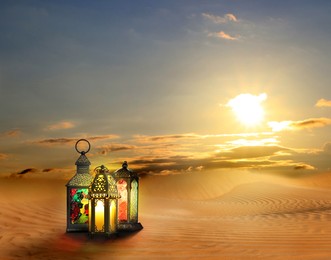 Image of Beautiful Arabic lanterns on sand at sunrise, space for text