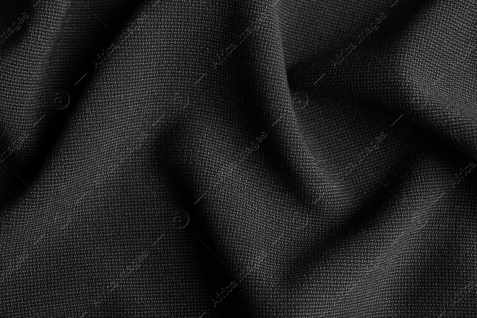 Photo of Texture of dark fabric as background, closeup