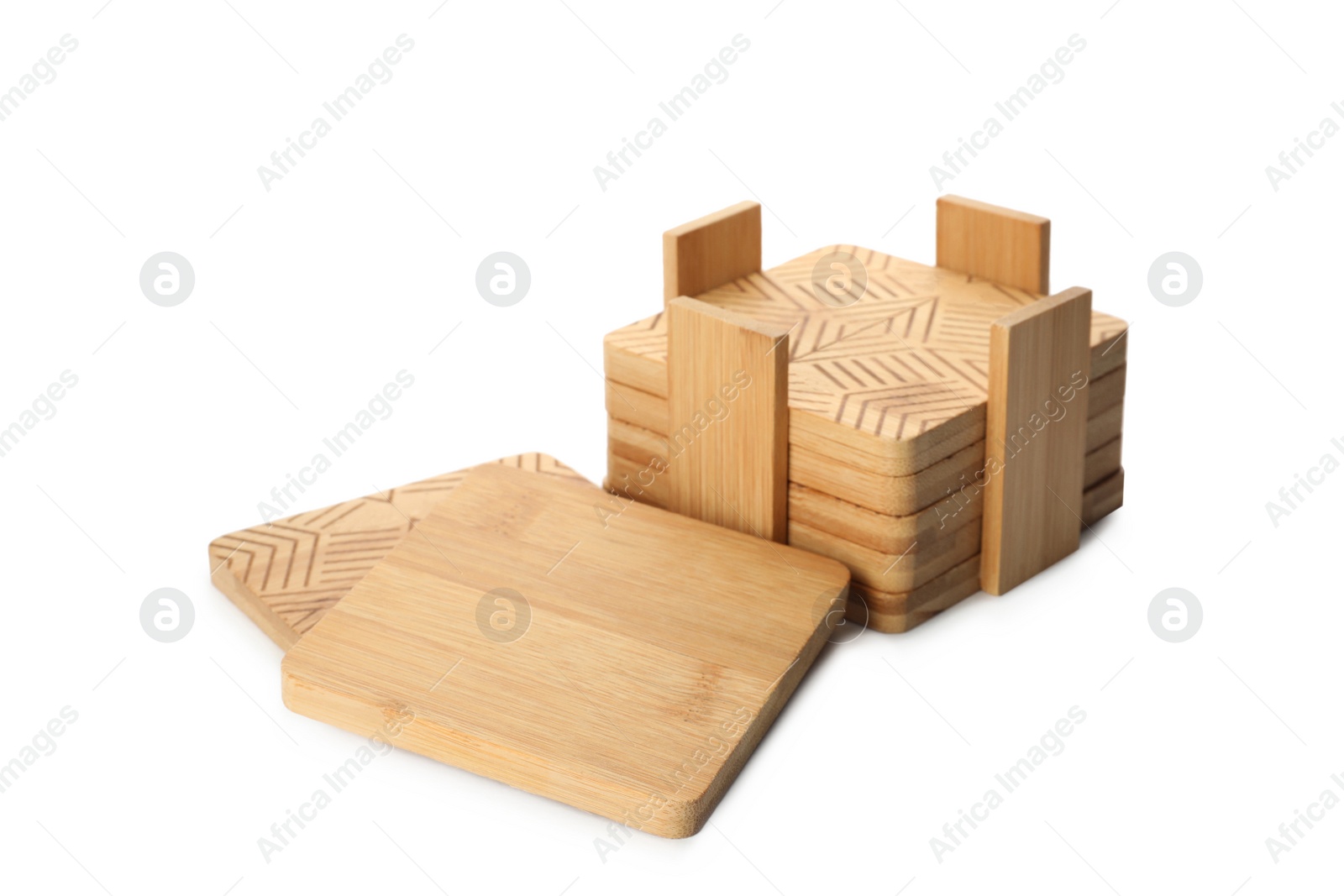 Photo of Stylish wooden cup coasters and holder on white background