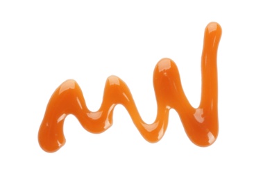 Stroke of delicious caramel sauce on white background, top view