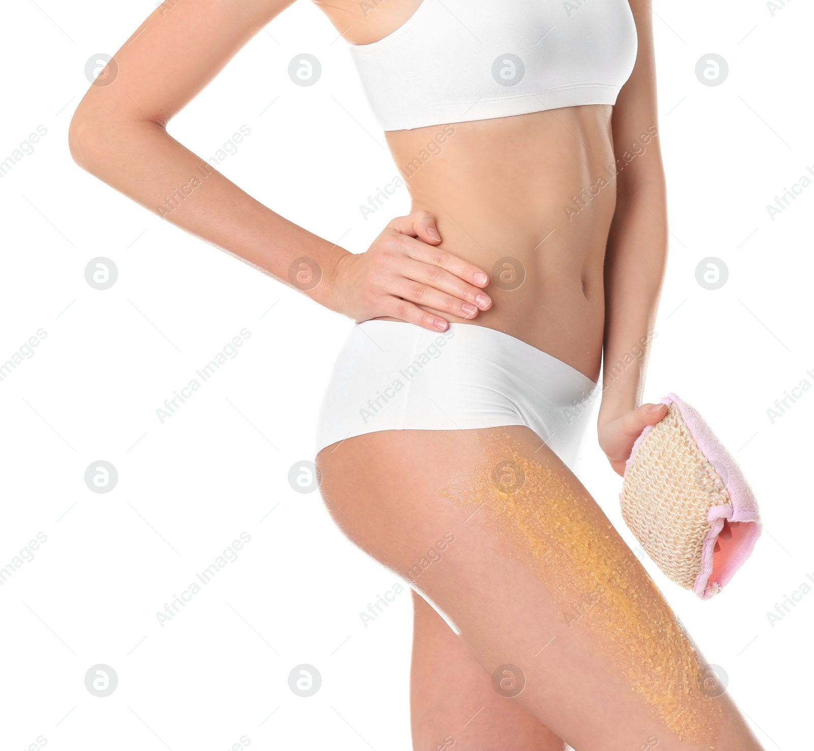 Photo of Young woman applying natural scrub on her body against white background