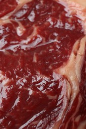 Texture of fresh beef meat as background, closeup