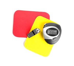 Whistle, stopwatch, red and yellow cards on white background, top view. Football rules