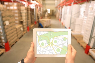 Image of Manager with tablet working at warehouse, closeup. Logistics center