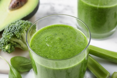 Photo of Delicious fresh green juice in glass, closeup