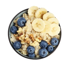 Tasty oatmeal with banana, blueberries and walnuts in bowl isolated on white, top view