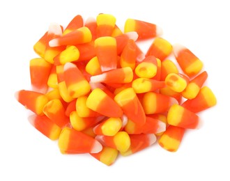 Photo of Delicious colorful candies on white background, top view. Halloween sweets