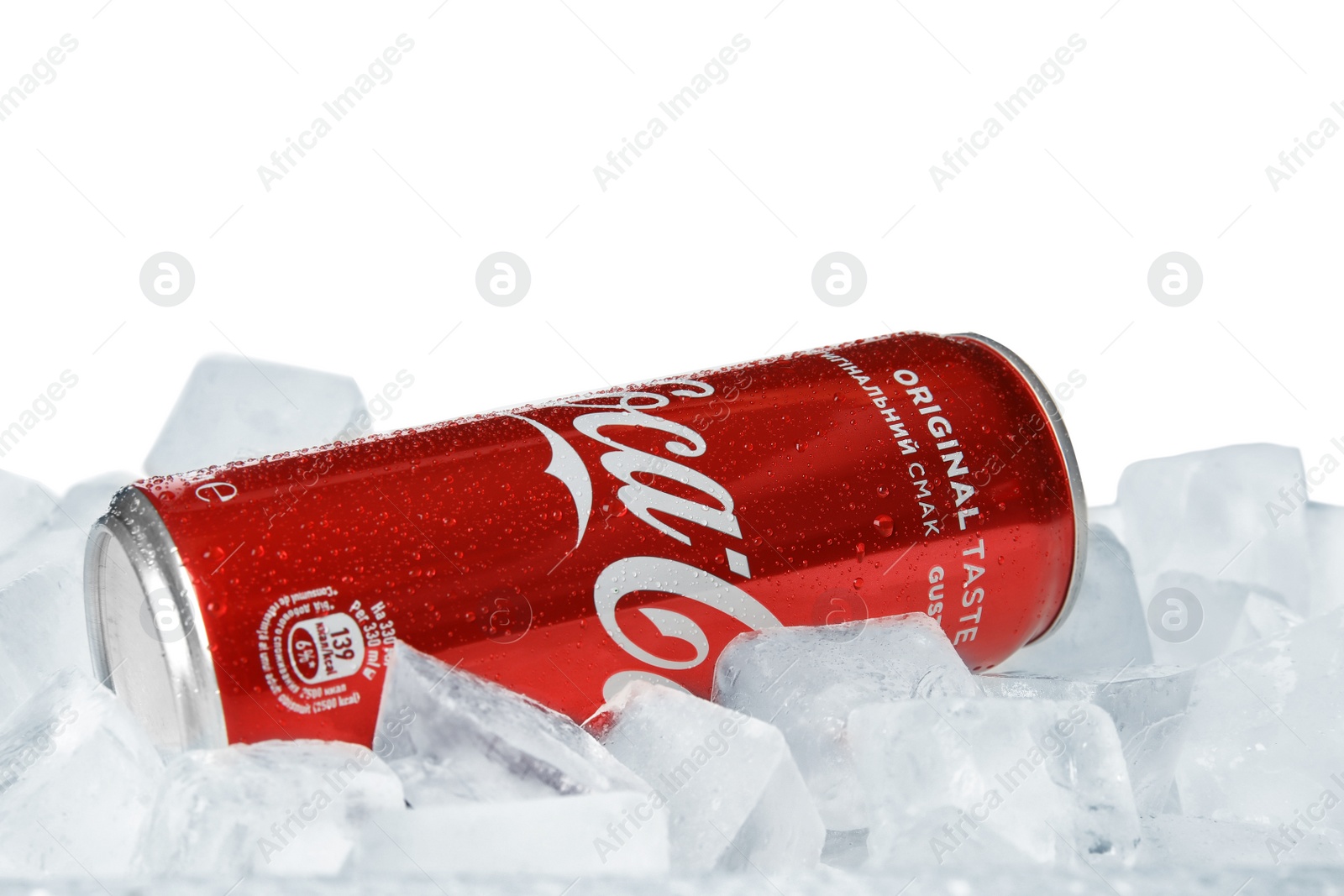 Photo of MYKOLAIV, UKRAINE - NOVEMBER 15, 2018: Coca Cola can on ice cubes against white background