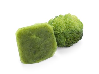 Photo of Frozen broccoli puree cube and fresh broccoli isolated on white