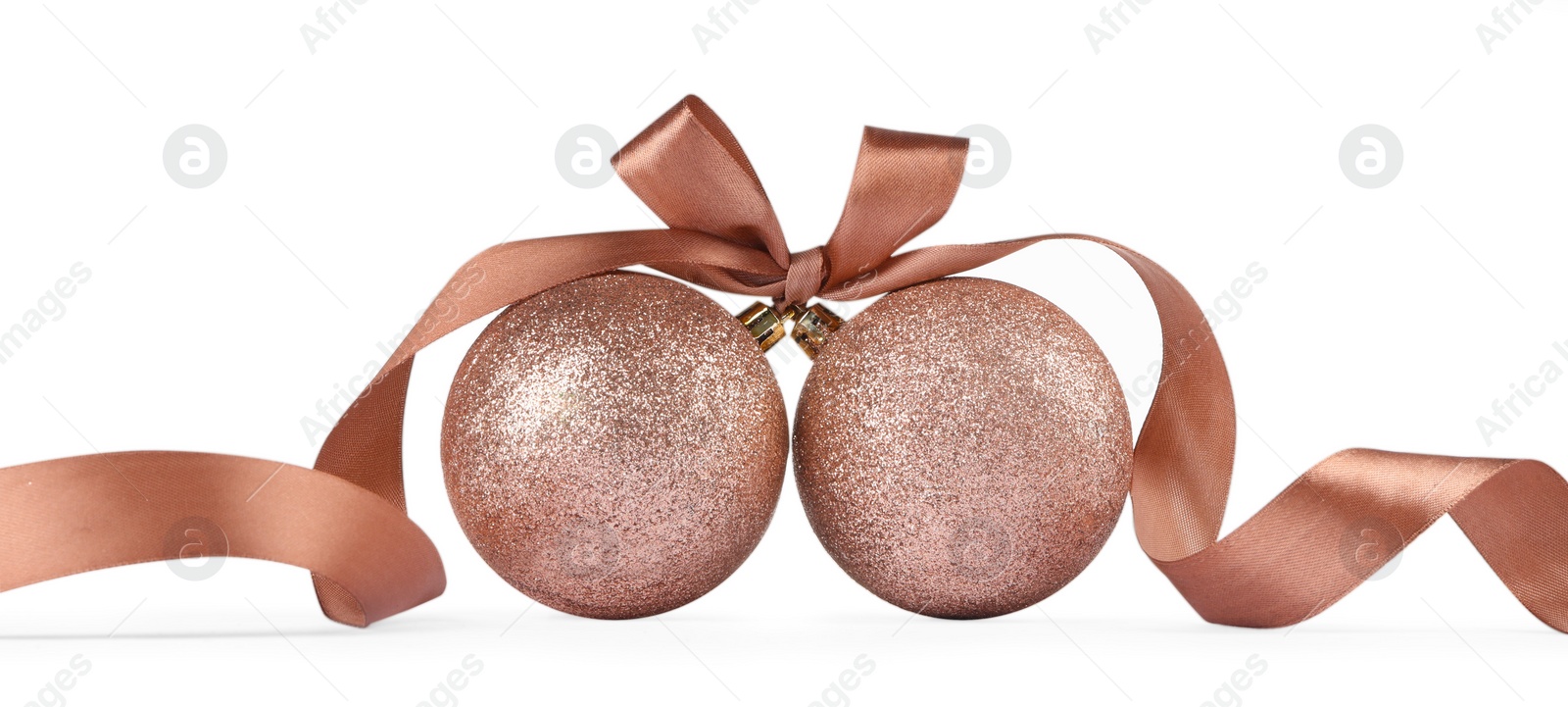 Photo of Beautiful coral Christmas balls with ribbon isolated on white