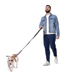 Smiling man walking with dog on white background, low angle view