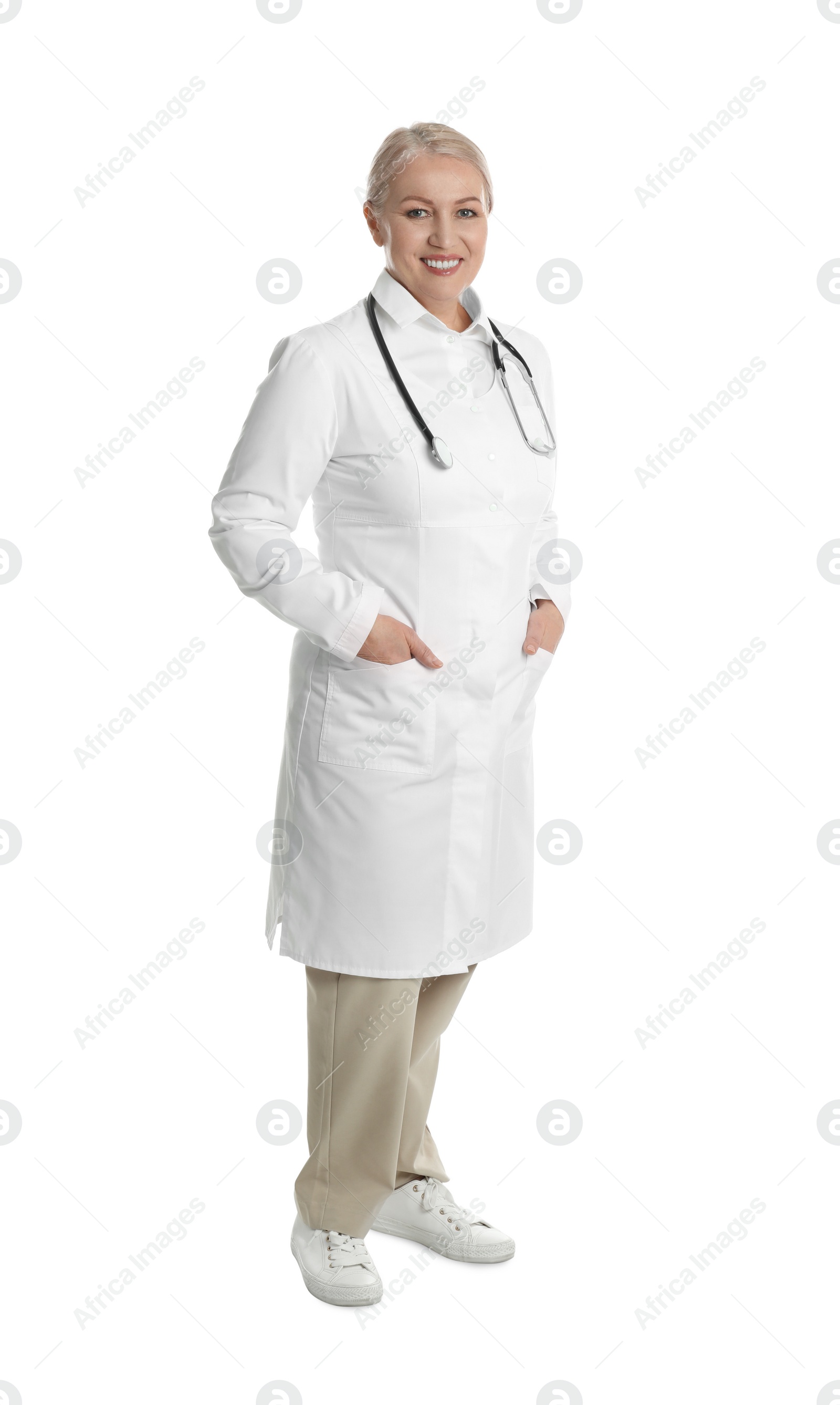 Photo of Mature doctor with stethoscope on white background