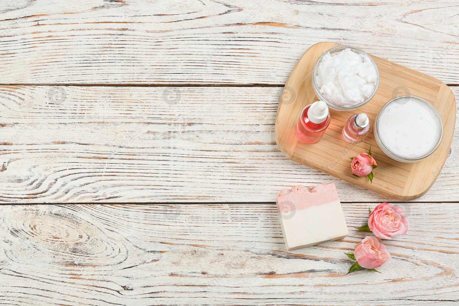 Photo of Flat lay composition with natural handmade soap and ingredients on white wooden table, space for text