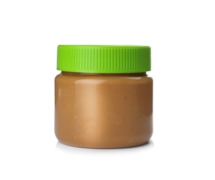 Photo of Jar with creamy peanut butter on white background