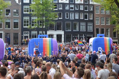 Photo of AMSTERDAM, NETHERLANDS - AUGUST 06, 2022: Many people at LGBT pride parade on summer day