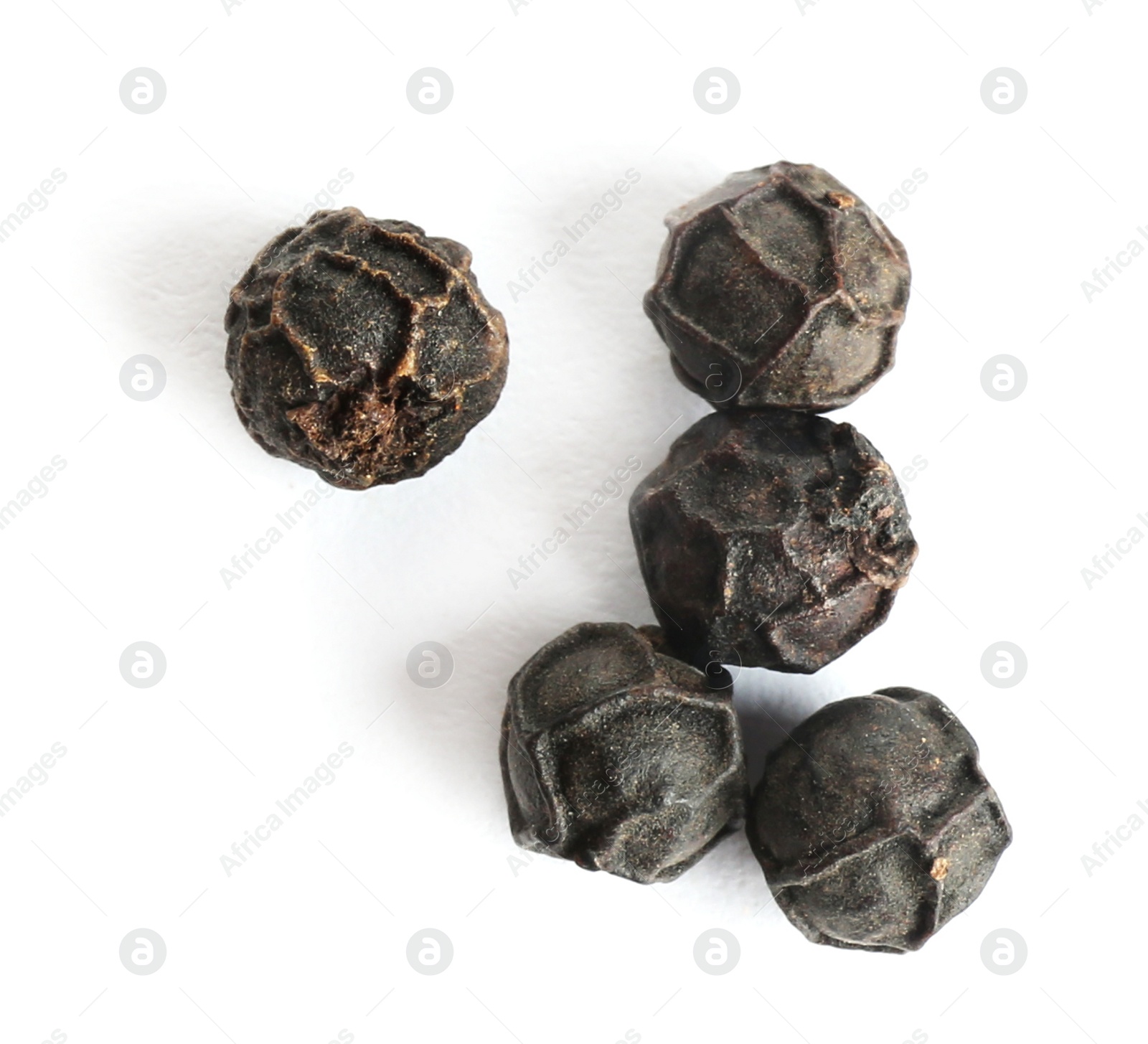 Photo of Black peppercorns isolated on white, top view