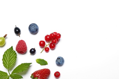 Mix of fresh berries on white background, flat lay. Space for text