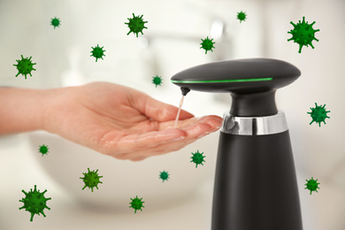 Woman using automatic soap dispenser in bathroom, closeup. Washing hands during coronavirus outbreak