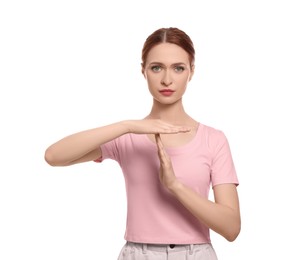 Photo of Woman showing time out gesture on white background