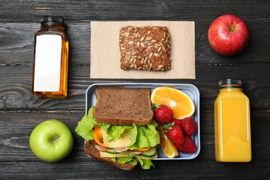 Flat lay composition with healthy food for school child on wooden background