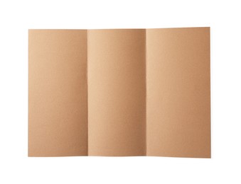 Photo of Folded kraft paper sheet isolated on white, top view