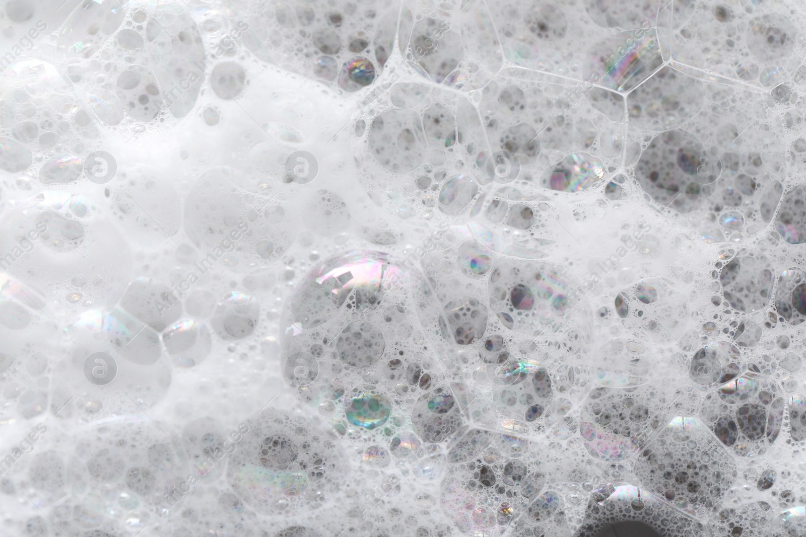 Photo of Closeup view of white fluffy washing foam