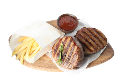 Photo of Delicious beef medallions with French fries and sauce isolated on white