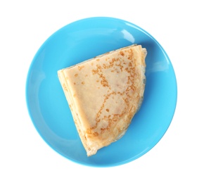Photo of Tasty thin folded pancakes on plate against white background, top view