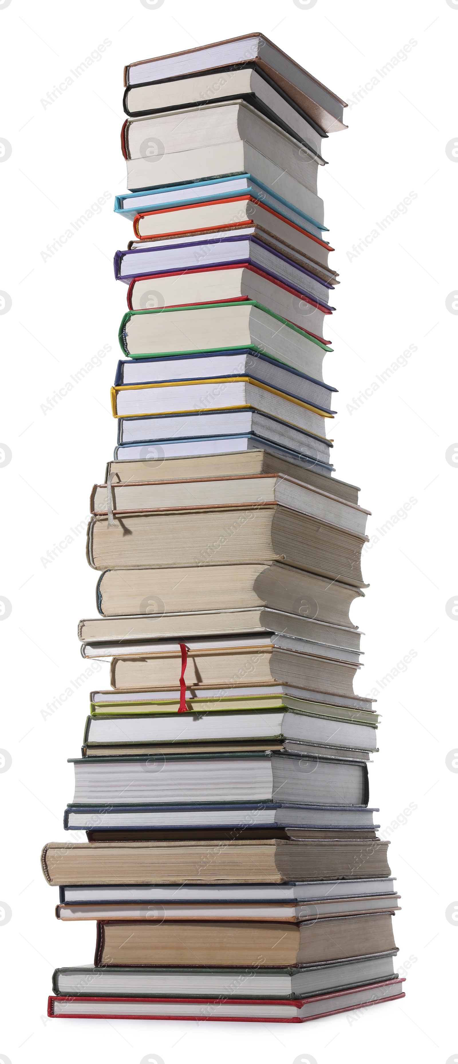 Photo of High stack of many different books isolated on white