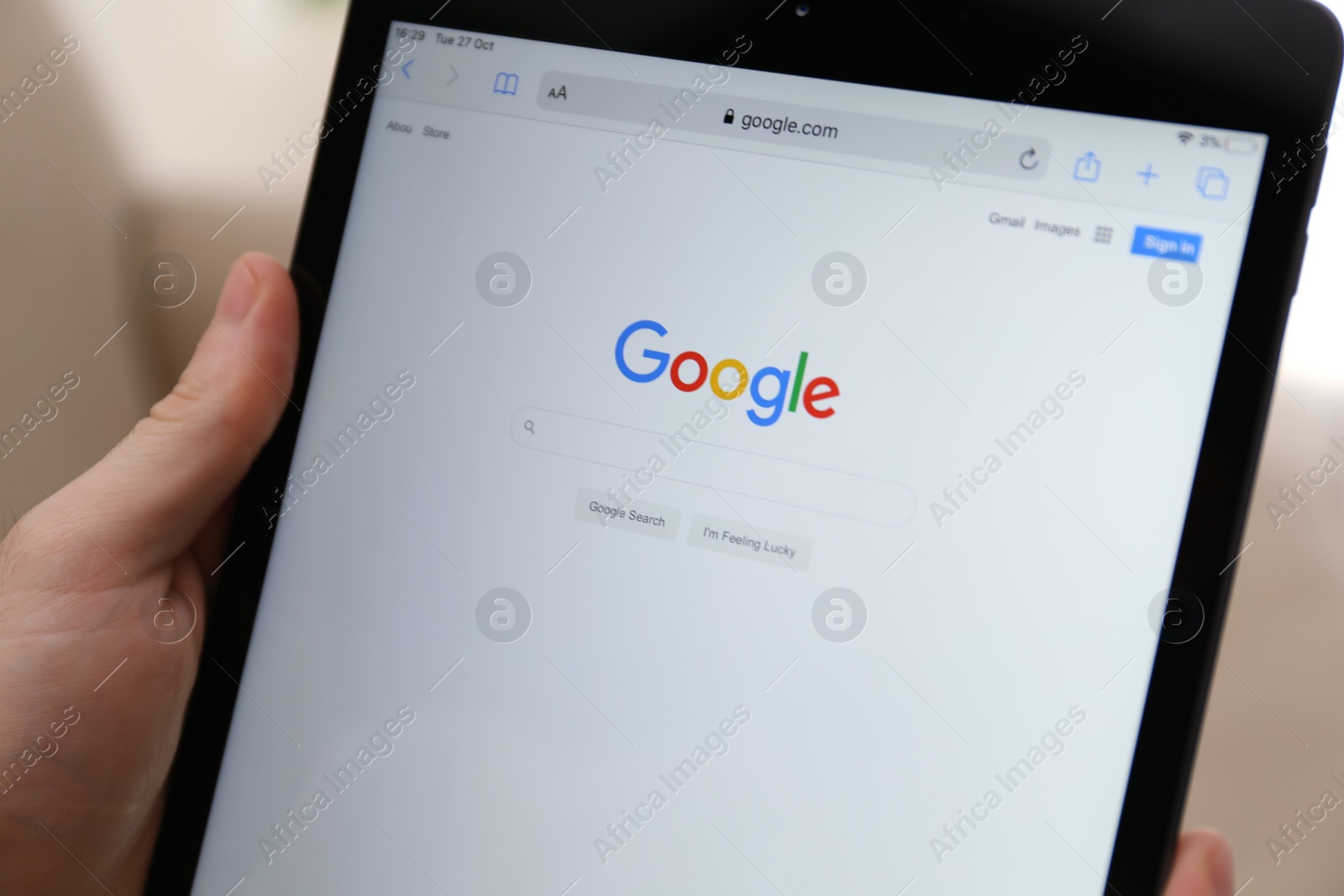 Photo of MYKOLAIV, UKRAINE - OCTOBER 27, 2020: Man using Google search engine on tablet against blurred background, closeup