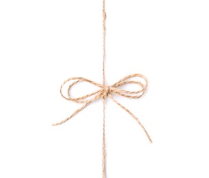 Photo of Linen rope string with bow isolated on white, top view