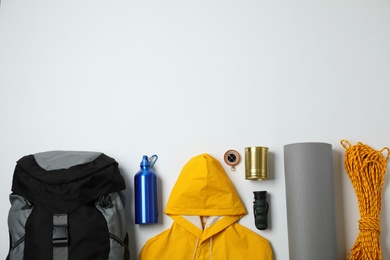 Flat lay composition with different camping equipment on white background
