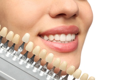 Photo of Woman checking her teeth color on white background, closeup. Cosmetic dentistry
