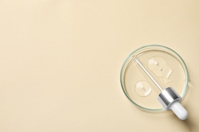 Photo of Petri dish with sample of cosmetic oil and pipette on beige background, top view. Space for text