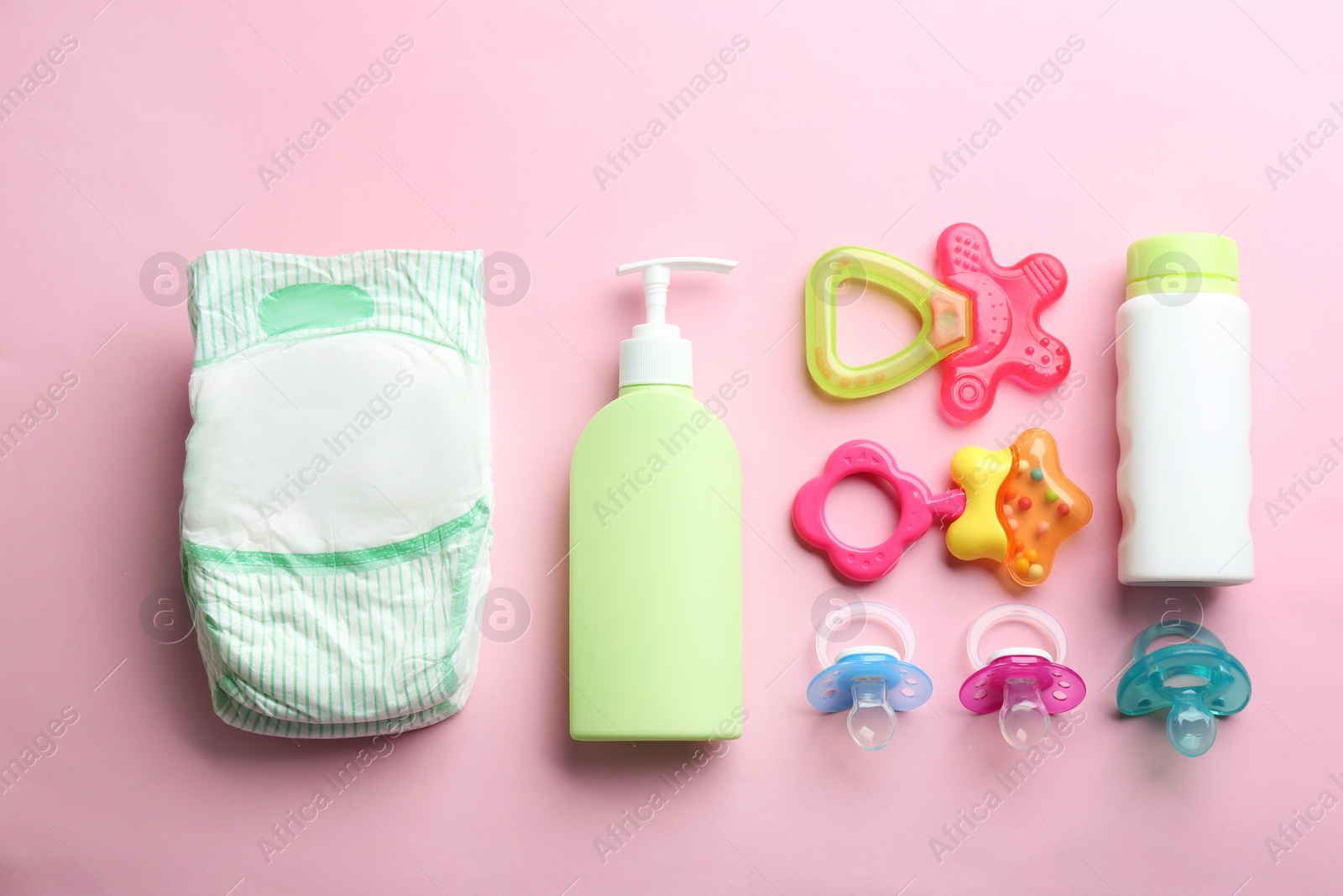 Photo of Flat lay composition with baby accessories on color background