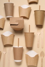 Photo of Flat lay composition with eco friendly food packagings on beige background