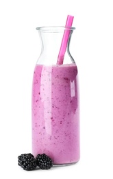 Photo of Delicious blackberry smoothie in glass bottle on white background