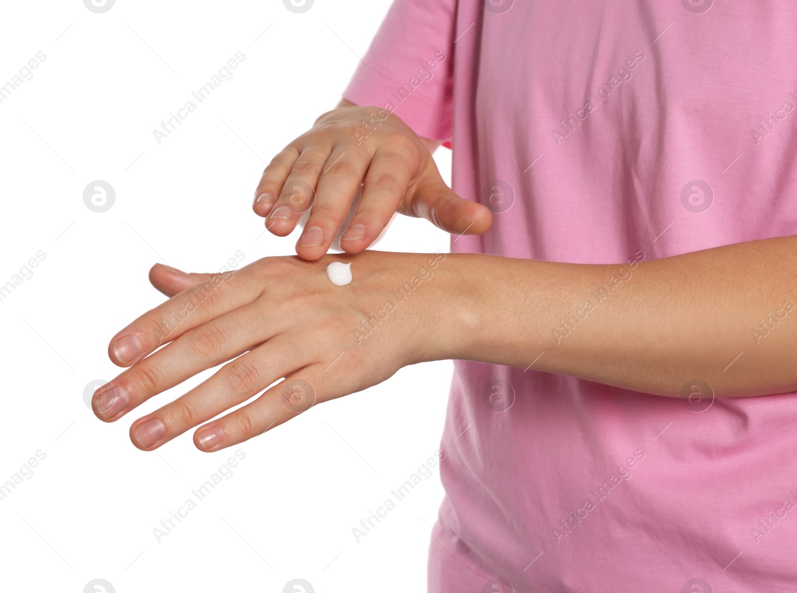 Photo of Woman applying cream on her hand against white background, closeup