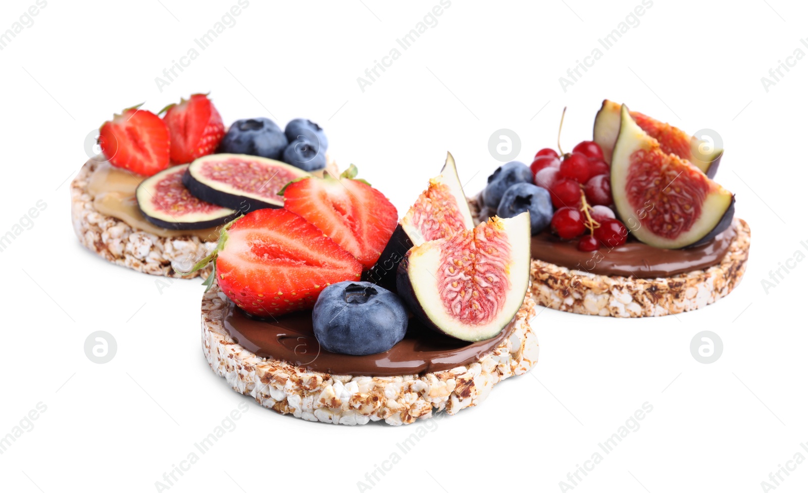 Photo of Tasty crispbreads with different toppings on white background