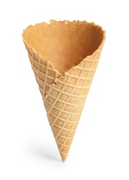 Photo of Empty wafer ice cream cone on white background